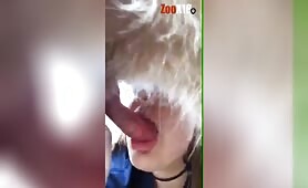 Girl gives dog a suck