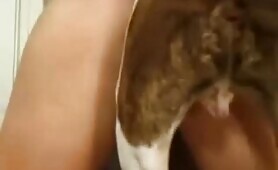 redhead pleases a big dog