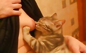 55591 russian woman breastfeeding a cat