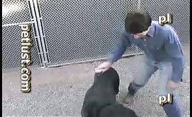 White male kiss a black dog